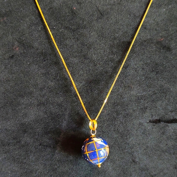 14k Gold and Gemstone pendant and chain.